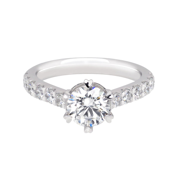 Diamond Engagement Ring. Centre Diamond Stone is 1 Carat, and includes 12 0.5 Carat Diamond Stones on the Band. Heart-shaped Prongs